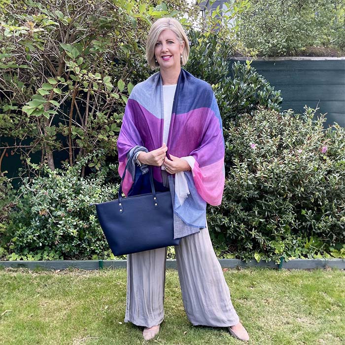 Kerri wearing a colorful cashmere wrap