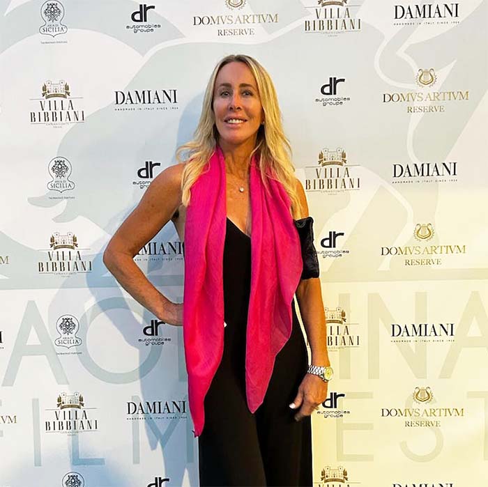Diane wearing a colorful cashmere scarf